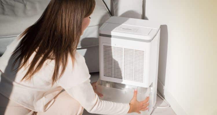 Dehumidifier running in a clean Annapolis home to reduce humidity and prevent mold growth