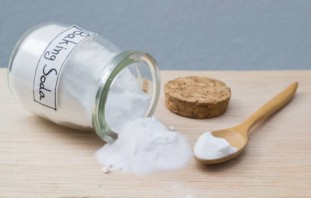 Baking soda all-purpose cleaner in a glass jar with wooden spoon