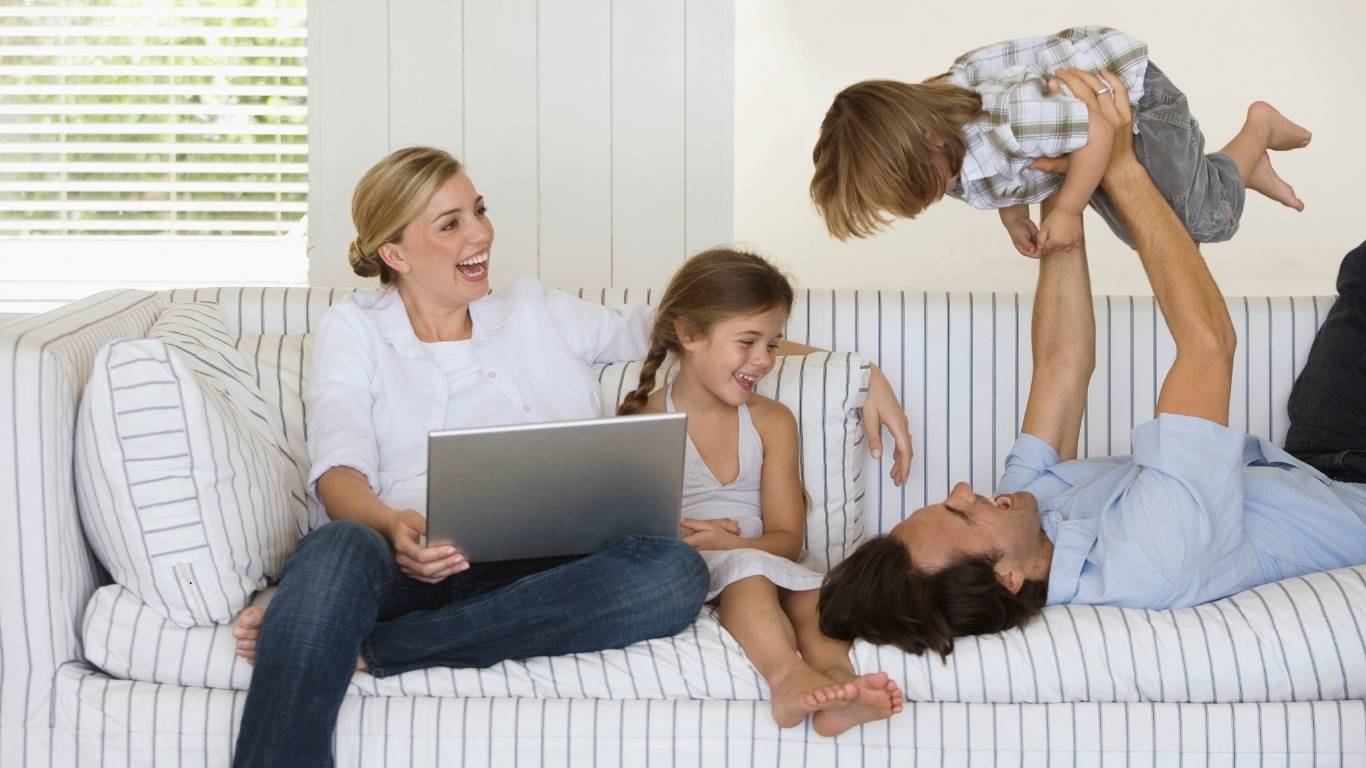 Family relaxing in a clean living room after recurring cleaning service